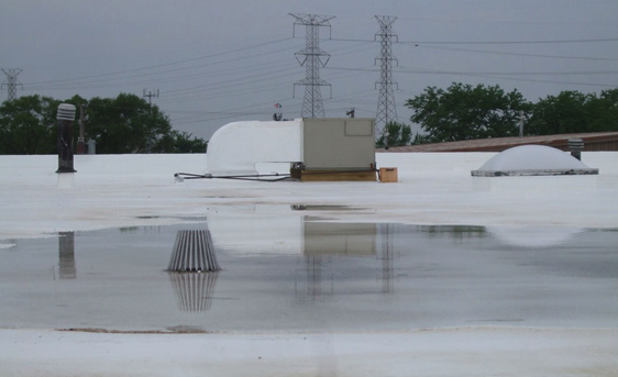 Ponding water near a seam split on a commercial flat roof